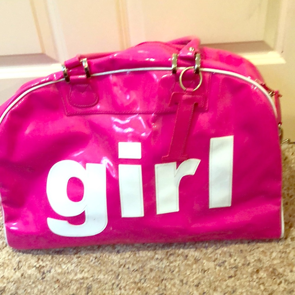 A hot pink large duffel bag.